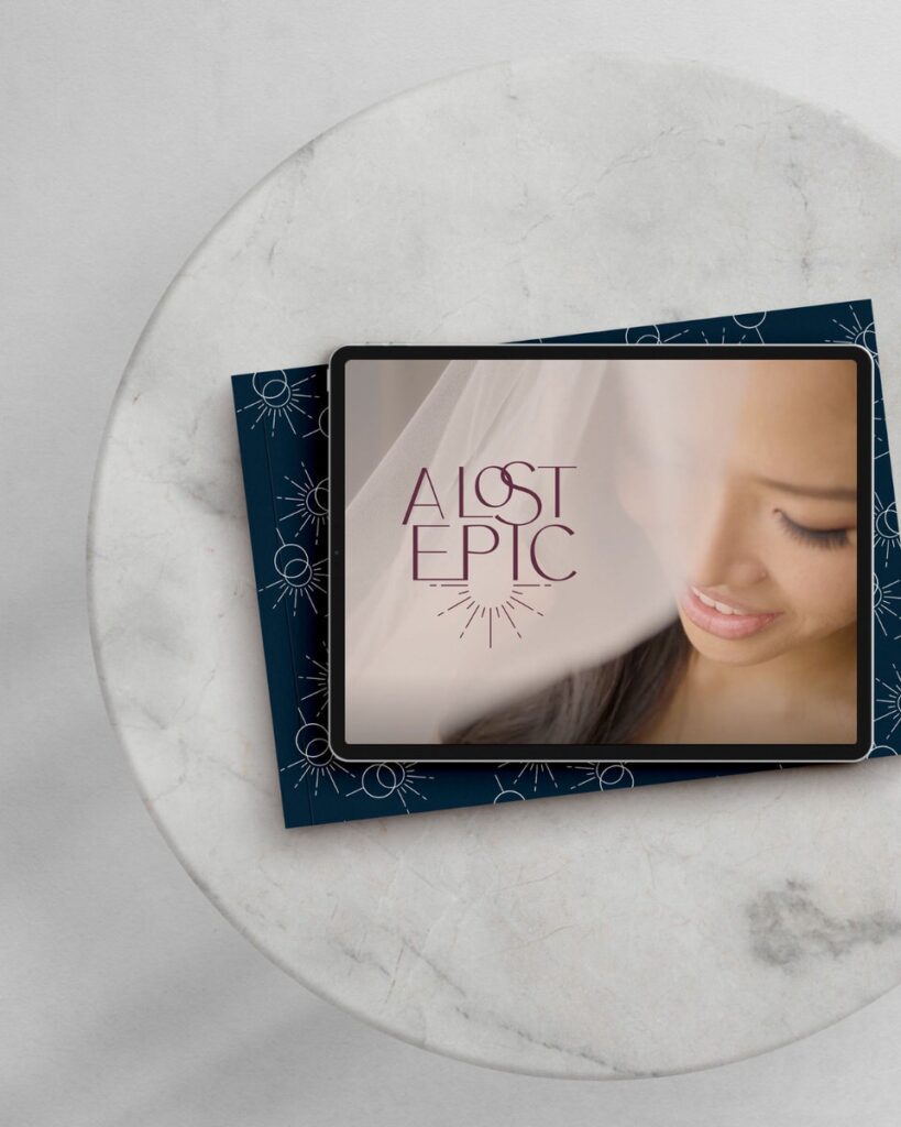 An iPad sitting on a round table. On the iPad is an image of a bride with her vail flowing in front of her  and a logo in the top left corner that reads "A Lost Epic"