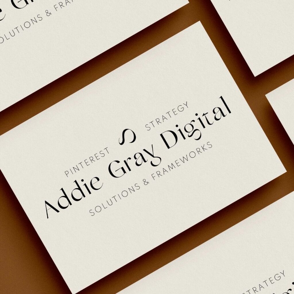Close up view of a business card in a row of business cards for the business "Addie Gray Digital. Pinterest strategy, solutions & frameworks".