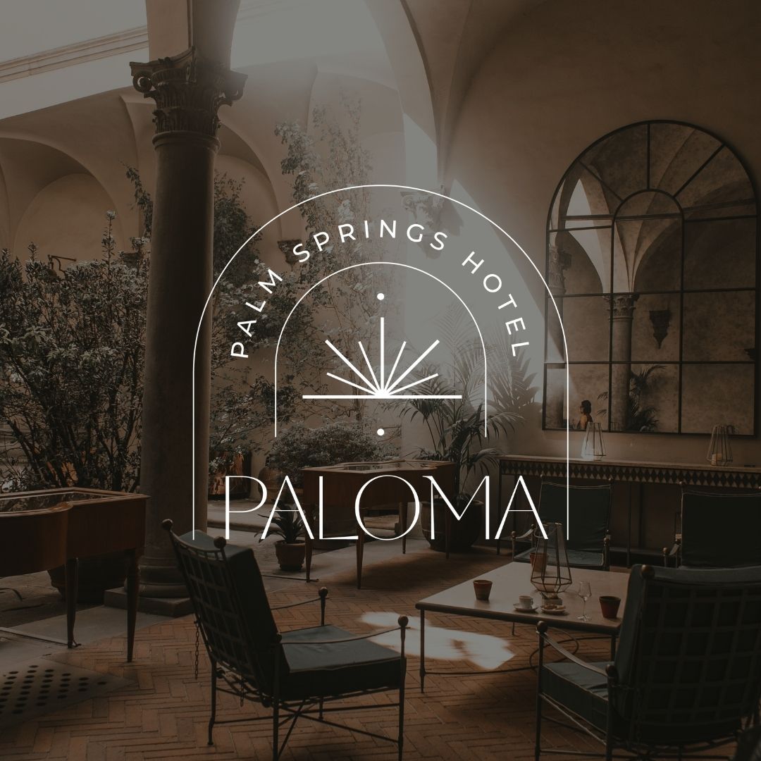 Image of an outdoor sitting area in a luxury home with a white logo on top that reads "Paloma Palm Springs Hotel".