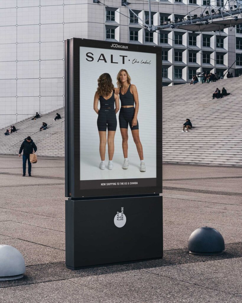 A street sign shows an advertisement for SALT.