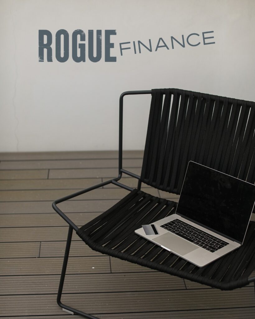 Rogue Finance logo on top of a laptop sitting on a chair.