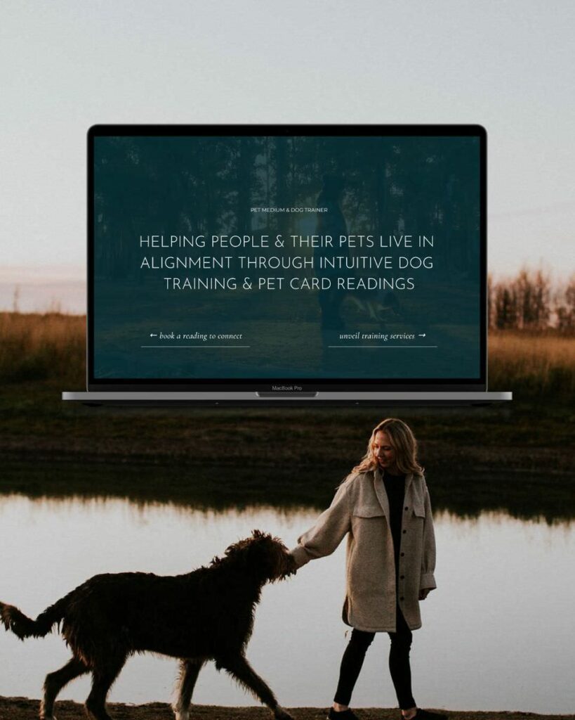 A laptop on a desk showing "The Dog Intuitive" website with a headline about helping people and their pets through intuitive dog training and pet card readings, against a serene outdoor backdrop.
